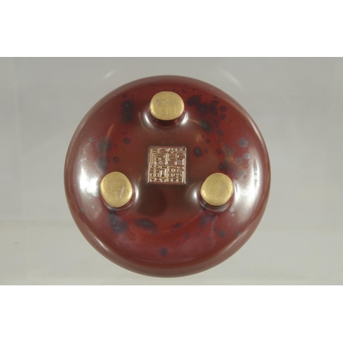 80 - A SMALL CHINESE MOTTLED RED GLAZE PORCELAIN TRIPOD CENSER, with gilt highlights and character mark, ... 