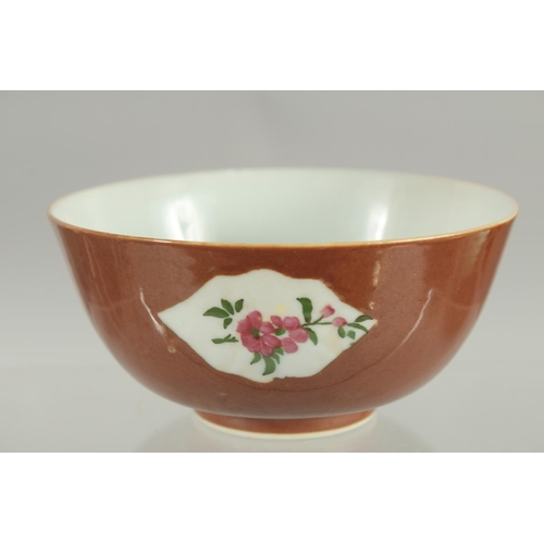 81 - A CHINESE FAMILLE ROSE PANELLED PORCELAIN BOWL, possibly Kangxi, 12cm diameter.