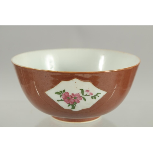 81 - A CHINESE FAMILLE ROSE PANELLED PORCELAIN BOWL, possibly Kangxi, 12cm diameter.