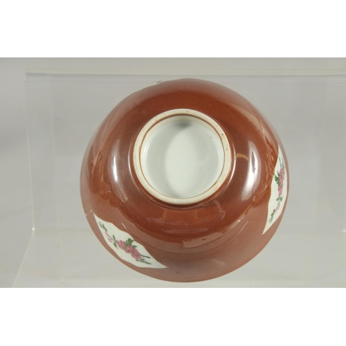 81 - A CHINESE FAMILLE ROSE PANELLED PORCELAIN BOWL, possibly Kangxi, 12cm diameter.