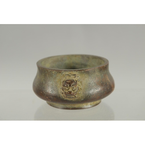 83 - A SMALL CHINESE TWIN HANDLE BRONZE CENSER, 10cm wide.