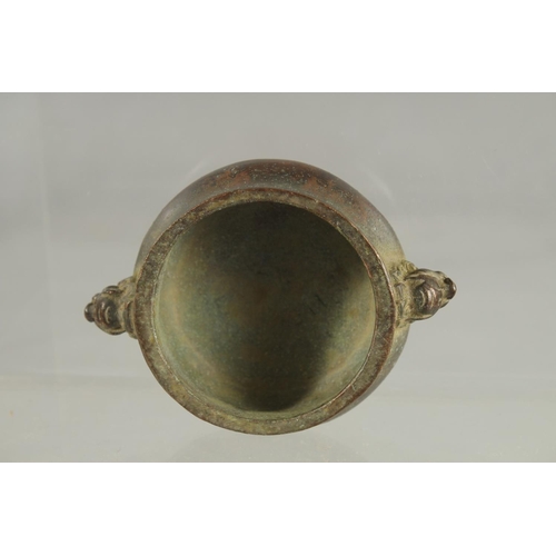 83 - A SMALL CHINESE TWIN HANDLE BRONZE CENSER, 10cm wide.