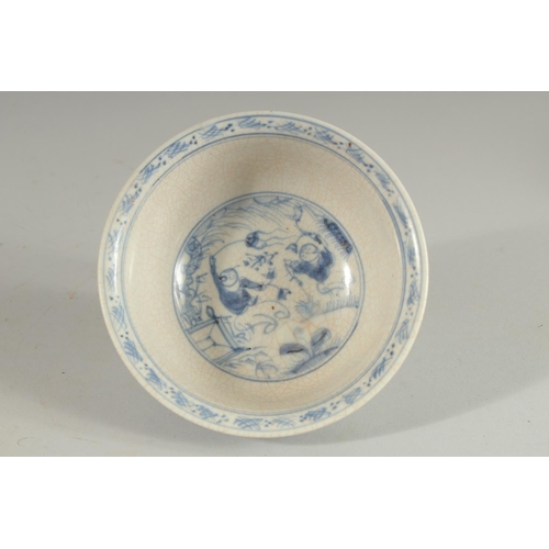 85 - A CHINESE BLUE AND WHITE PORCELAIN BOWL, painted with boys, 14cm diameter.