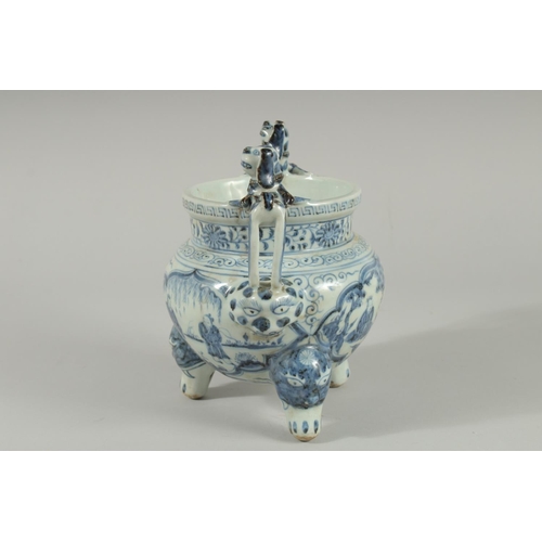 90 - A CHINESE BLUE AND WHITE PORCELAIN TRIPOD CENSER, with moulded dog handles, 20.5cm high.