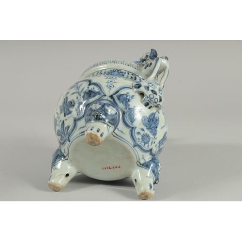 90 - A CHINESE BLUE AND WHITE PORCELAIN TRIPOD CENSER, with moulded dog handles, 20.5cm high.