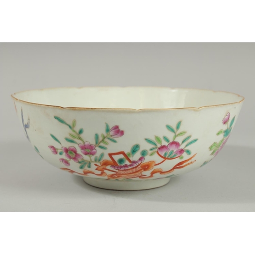 93 - AN EARLY 20TH CENTURT CHINESE FAMILLE ROSE BOWL, painted with flora and precious objects, the interi... 