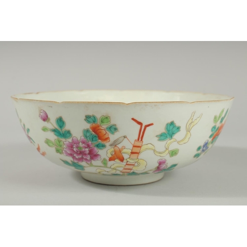 93 - AN EARLY 20TH CENTURT CHINESE FAMILLE ROSE BOWL, painted with flora and precious objects, the interi... 