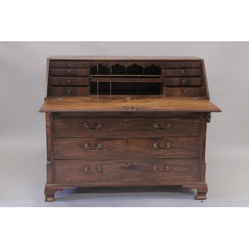 1002 - A GOOD GEORGE III MAHOGANY BUREAU with fall flap, fitted interior over two short and three long grad... 