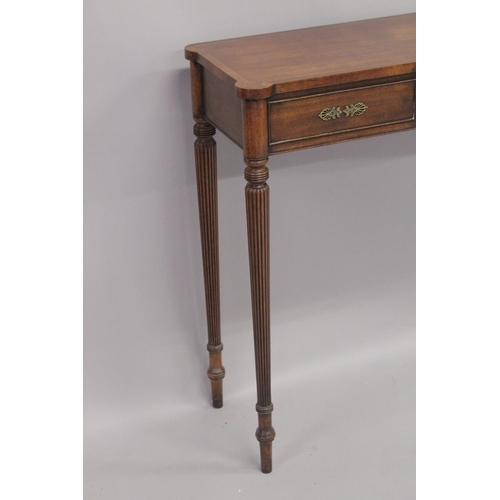 1005 - A REGENCY DESIGN MAHOGANY LONG SIDE TABLE with bow front, cross banded top, single frieze top on flu... 