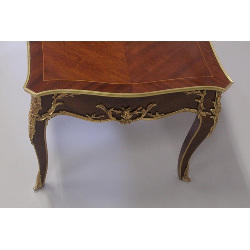 1009 - A LOUIS XVITH STYLE MAHOGANY INLAID COFFEE TABLE with floral crossbanded  legs on curving legs. 4ft ... 