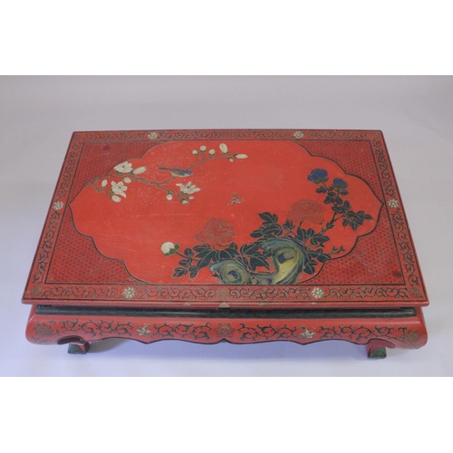 1018 - A CHINESE RED LACQUERED RECTANGULAR TOP TABLE on four curving legs. 3ft 4ins long, 2ft wide.