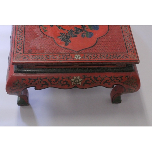 1018 - A CHINESE RED LACQUERED RECTANGULAR TOP TABLE on four curving legs. 3ft 4ins long, 2ft wide.