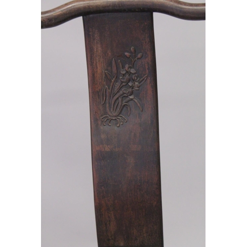 1032 - A PAIR OF CHINESE HARDWOOD CHAIRS with carved panel backs. 3ft 7ins high.