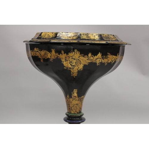 1047 - A VICTORIAN PAPIER MACHE TEA POUY ON A TRIPOD BASE, inlaid with mother of pearl and decorated in gil... 