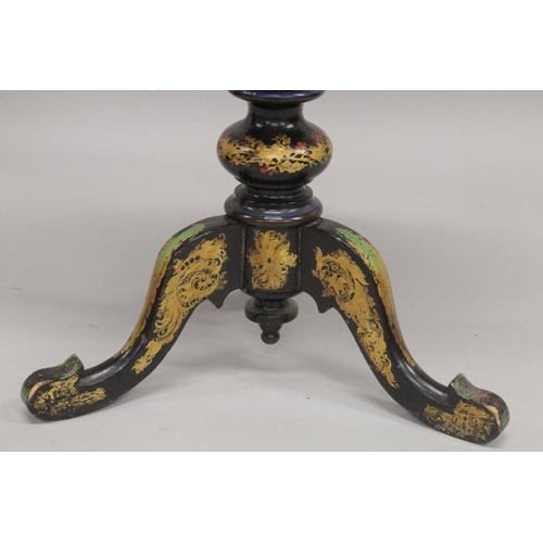 1047 - A VICTORIAN PAPIER MACHE TEA POUY ON A TRIPOD BASE, inlaid with mother of pearl and decorated in gil... 