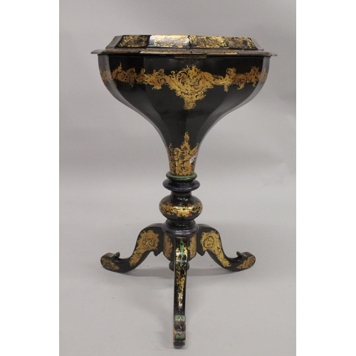 1047 - A VICTORIAN PAPIER MACHE TEA POUY ON A TRIPOD BASE, inlaid with mother of pearl and decorated in gil... 