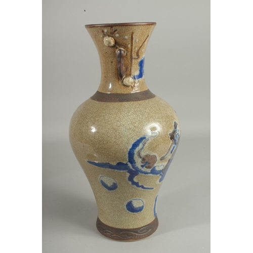 1238 - A CHINESE CRACKLE GLAZE AND BLUE PO0RCELAIN VASE. 16ins high.