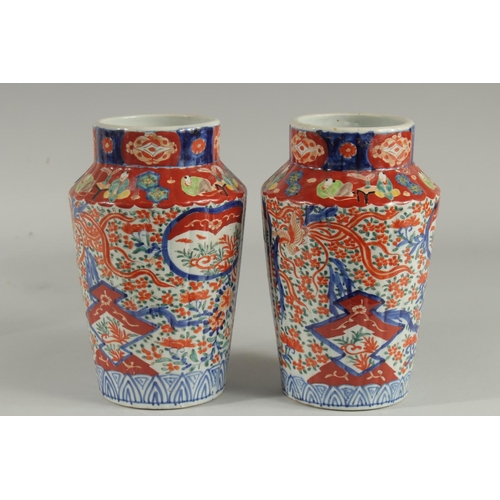 1239 - A PAIR OF IMARI VASES. 9.5ins high.