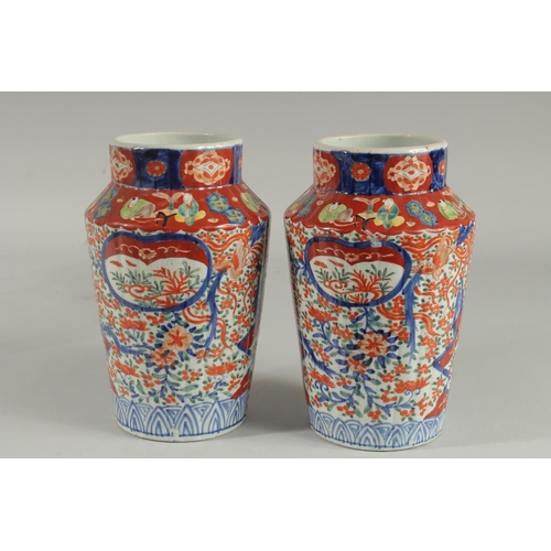 1239 - A PAIR OF IMARI VASES. 9.5ins high.