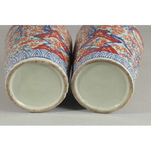 1239 - A PAIR OF IMARI VASES. 9.5ins high.