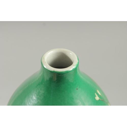 1242 - A CHINESE GREEN PORCELAIN DOUBLE GOURD VASE decorated with flowers. Six-character mark in blue.