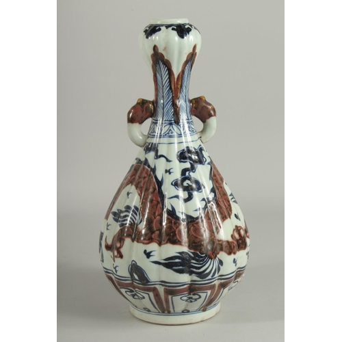 1243 - A CHINESE BLUE AND BRONZE GARLIC HEAD VASE with dragon design.