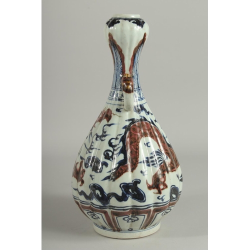 1243 - A CHINESE BLUE AND BRONZE GARLIC HEAD VASE with dragon design.