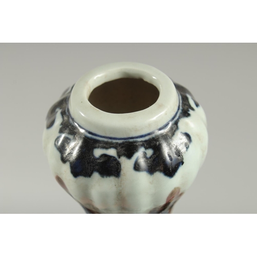 1243 - A CHINESE BLUE AND BRONZE GARLIC HEAD VASE with dragon design.