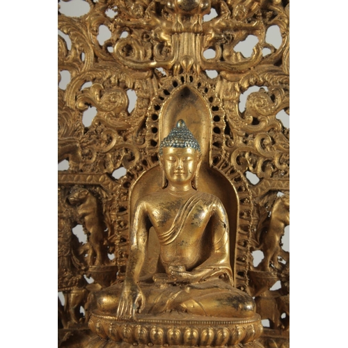 1250 - A GOOD GILT BRONZE BUDDHA with halo, on a rectangular base. 11ins high.