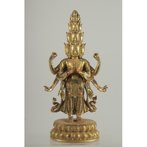 1256 - A GOOD BRONZE MULTI HEAD DEITY on an oval base.