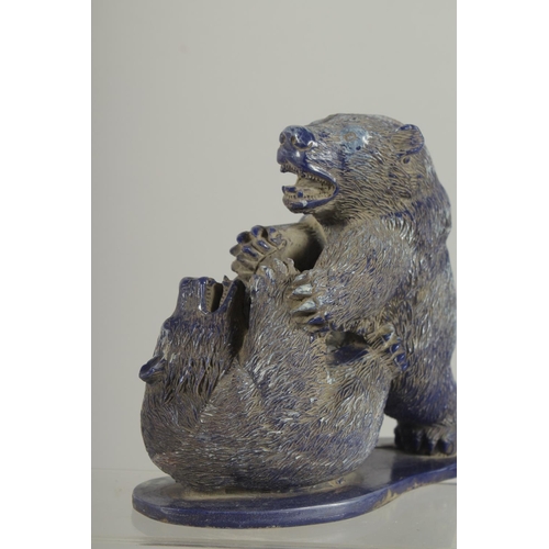 1259 - A GOOD PAIR OF CARVED LAPIS BEARS on a shaped base. 6ins high.