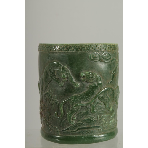 1260 - A CHINESE CARVED JADE CIRCULAR BRUSH POT. 5ins.