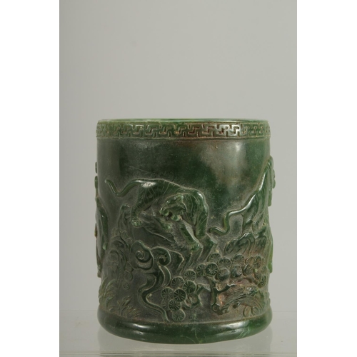 1260 - A CHINESE CARVED JADE CIRCULAR BRUSH POT. 5ins.