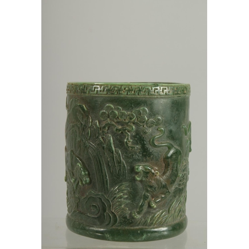 1260 - A CHINESE CARVED JADE CIRCULAR BRUSH POT. 5ins.