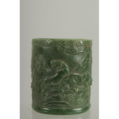 1260 - A CHINESE CARVED JADE CIRCULAR BRUSH POT. 5ins.