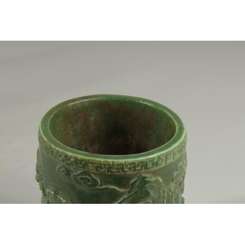 1260 - A CHINESE CARVED JADE CIRCULAR BRUSH POT. 5ins.