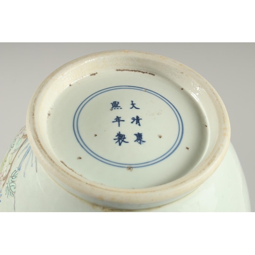 1267 - A CHINESE BULBOUS VASE painted with flowers and birds in famille rose. Six character mark in blue.... 