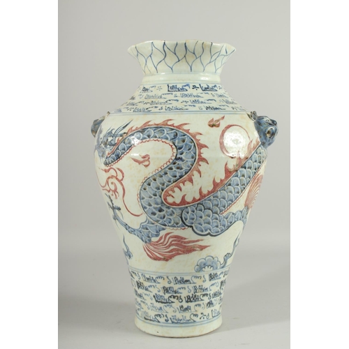 1268 - A LARGE CHINESE BLUE AND WHITE VASE with dragon decoration. 17ins high.