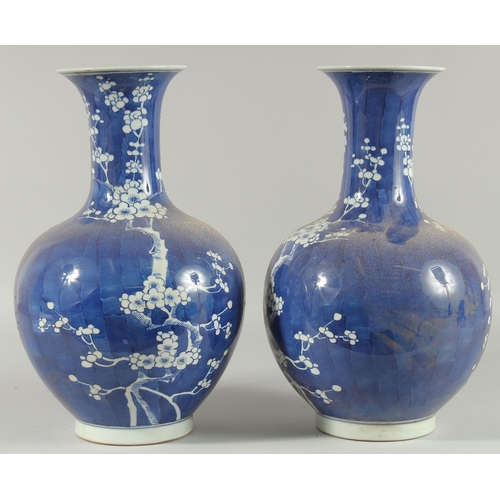 1271 - A PAIR OF CHINESE BLUE AND WHITE VASES, almond blossom. 14ins high.