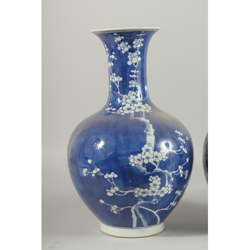 1271 - A PAIR OF CHINESE BLUE AND WHITE VASES, almond blossom. 14ins high.