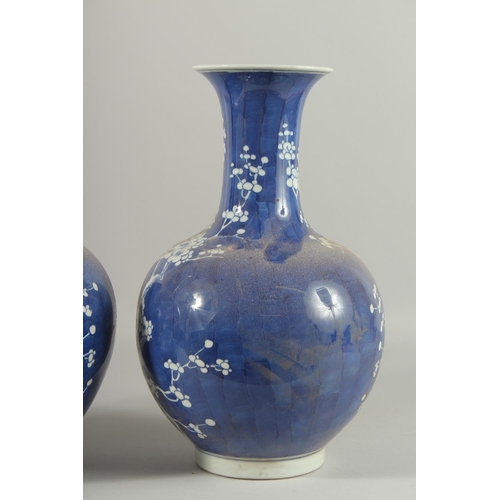 1271 - A PAIR OF CHINESE BLUE AND WHITE VASES, almond blossom. 14ins high.