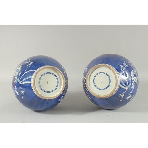 1271 - A PAIR OF CHINESE BLUE AND WHITE VASES, almond blossom. 14ins high.