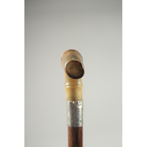 1369 - A VICTORIAN RHINO HORN HANDLE WALKING CANE with silver band. Birmingham.