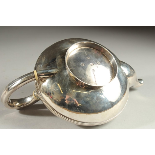 1951 - A GOOD VICTORIAN SILVER CIRCULAR TEAPOT by BENJAMIN SMITH. London 1840.  Weight 17ozs.