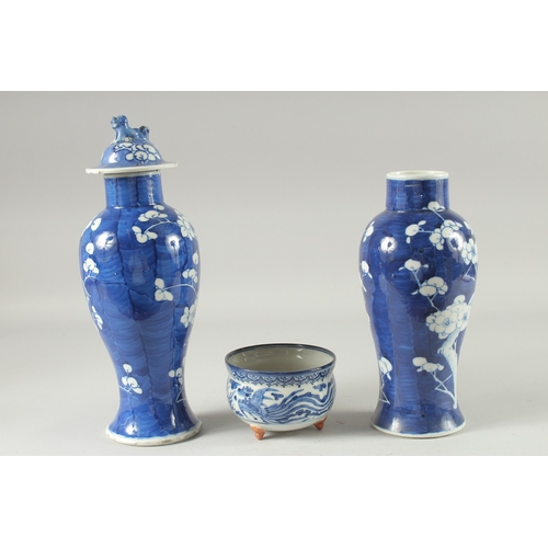 10 - A PAIR OF CHINESE BLUE AND WHITE PORCELAIN PRUNUS JARS, (one lacking cover, af), together with a blu... 