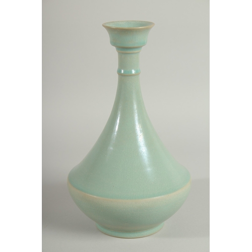 107 - A CHINESE CELADON VASE, 26.5cm high.