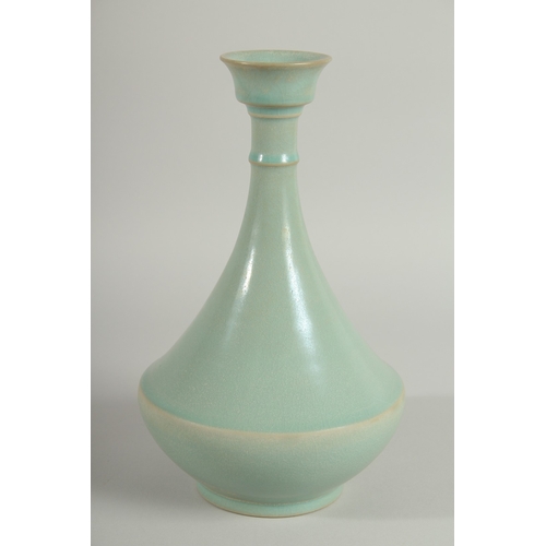 107 - A CHINESE CELADON VASE, 26.5cm high.