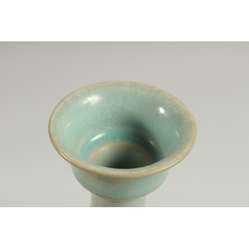 107 - A CHINESE CELADON VASE, 26.5cm high.