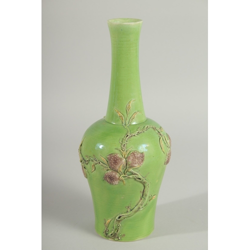 108 - A CHINESE GREEN GROUND CARVED PEACH VASE, with fine moulded and carved relief decoration around the ... 