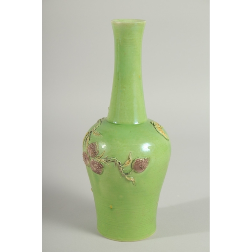 108 - A CHINESE GREEN GROUND CARVED PEACH VASE, with fine moulded and carved relief decoration around the ... 